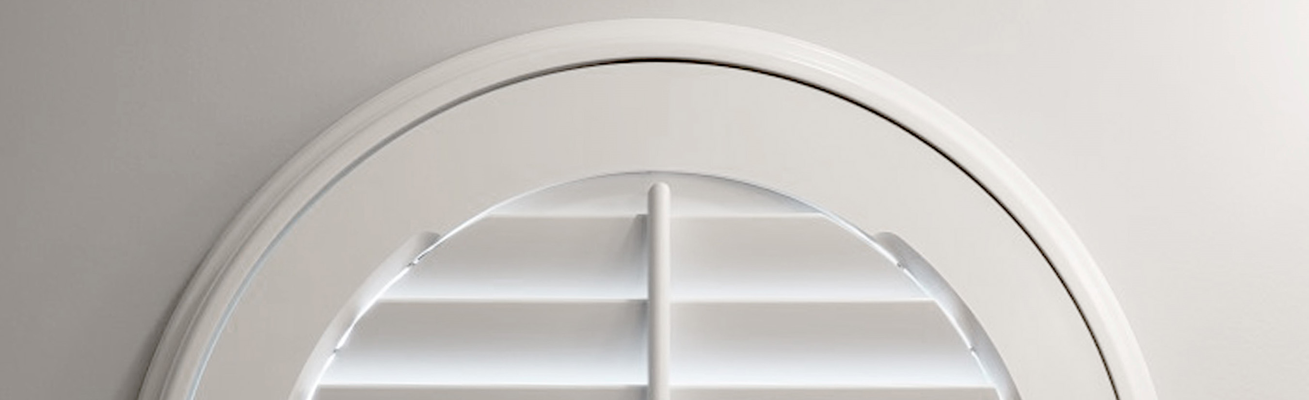 White circle shutter on a wall close up.