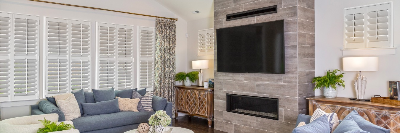 Plantation shutters in Glendale family room with fireplace