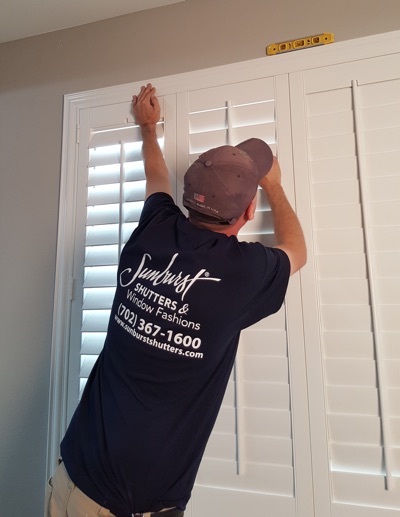 Shutter installation in Phoenix bedroom.