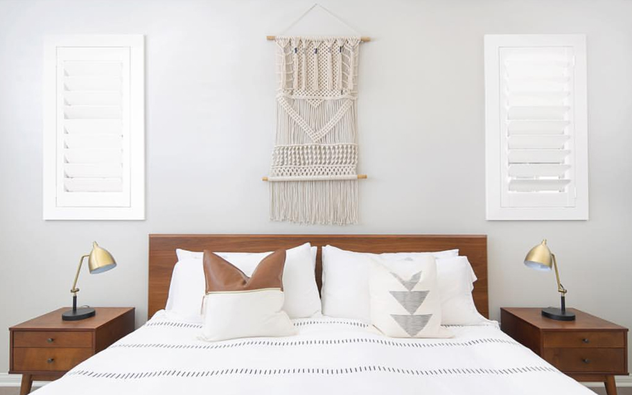 Custom-fitted louvered shutters provide excellent nighttime privacy in Phoenix. Photo Credit: Audrey Crisp Louvered shutters in a bedroom.
