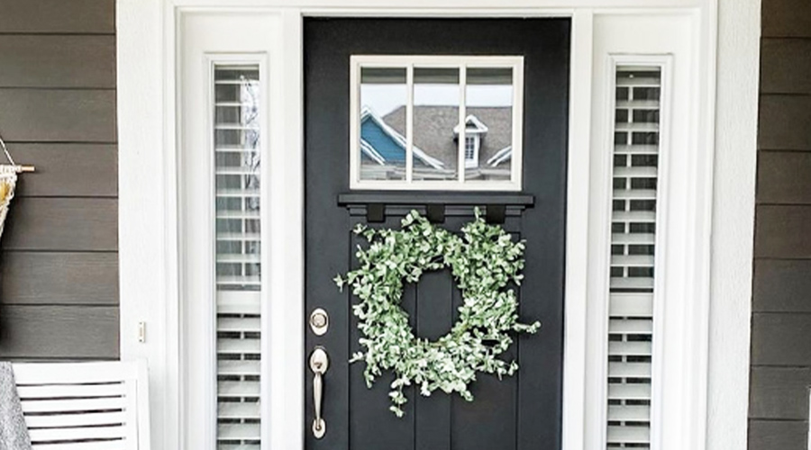 Sidelight window shutters next to front door.