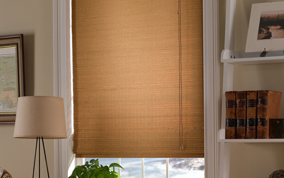 Add a touch of nature to your decor with woven fiber shades in Phoenix. Tan woven fiber shades in a living room