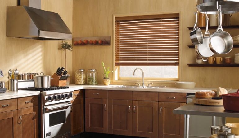 Faux wood blinds look amazing in Phoenix kitchens. Phoenix kitchen faux wood blinds.