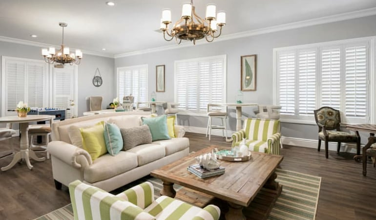 Photo Credit: Room Resolutions Interior Design Plantation shutters in a great room