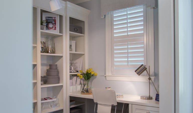 Updating your chair is a simple upgrade that can make a huge difference. Home office with polywood shutters.