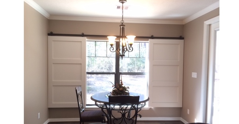 Barn doors open horizontally with slides instead of cords. Phoenix barn door shutters