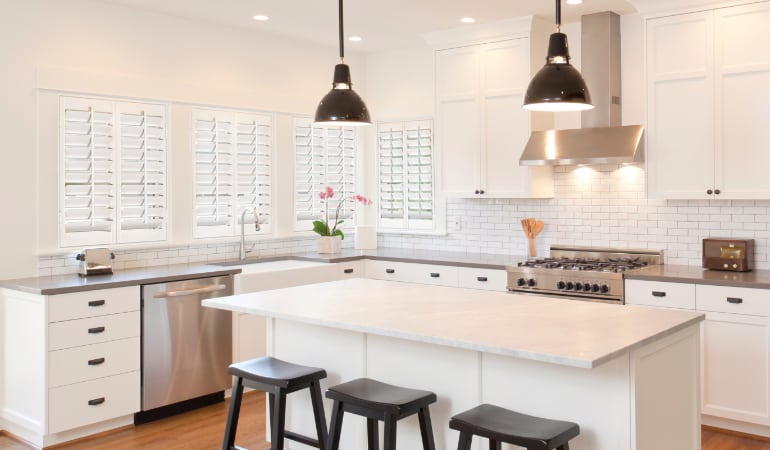Plantation shutters let you control the amount of light in your kitchen. Plantation shutters in a bright Phoenix kitchen.