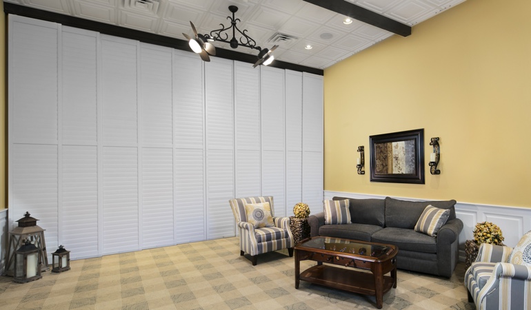 Shutters can be used to divide up a room. Interior shutters as a room divider for a showroom