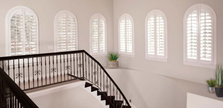 Custom window treatments perfectly cover your window and smoothly open and close. Arched Plantation Shutters