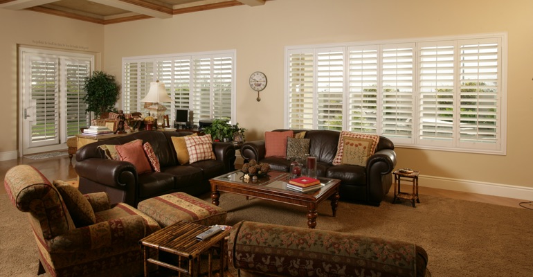 Shutters can let in as much light as you want. Phoenix great room with white shutters.