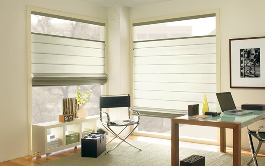 Upgrade your windows with stylish window shades or shutters in Phoenix. Stylish sheer shades in the corner of a modern office.