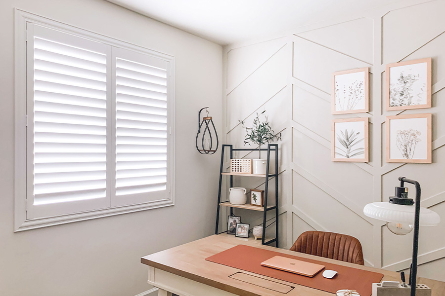 Polywood shutters give you maximum control over natural light in your Phoenix home. Photo Credit: @OurLakepoint Farmhouse  White and off-white farmhouse style office with natural light from polywood shutters.