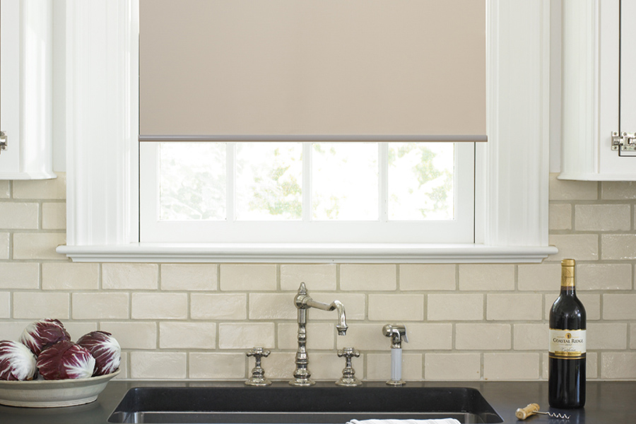 Roller shades opens up a lot of color and style options for your gourmet kitchen at Phoenix. Roller shade above a kitchen sink.