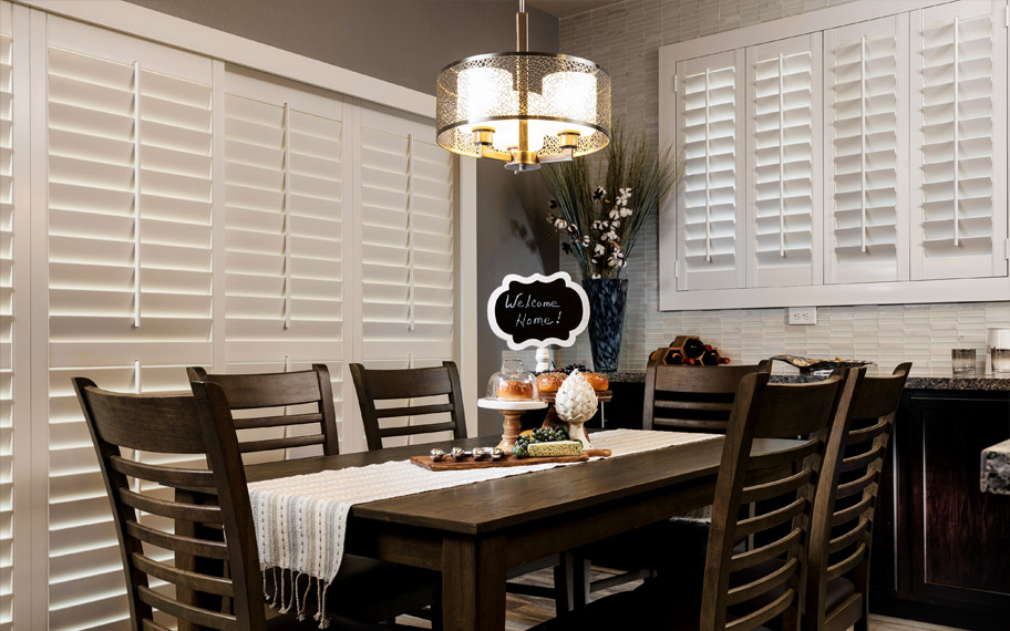 Polywood shutters add ultimate privacy and durability for everyday use. White polywood shutters in a kitchen.