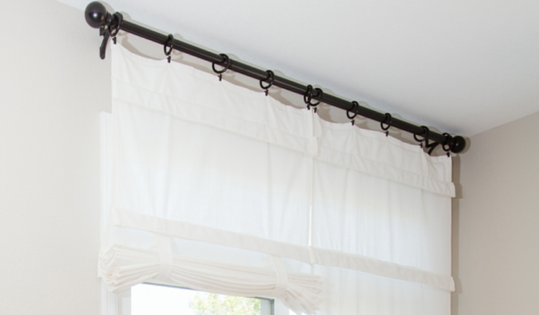 Tumble shades in Phoenix give your doors privacy versatility and style. White tumble shade on double glass doors